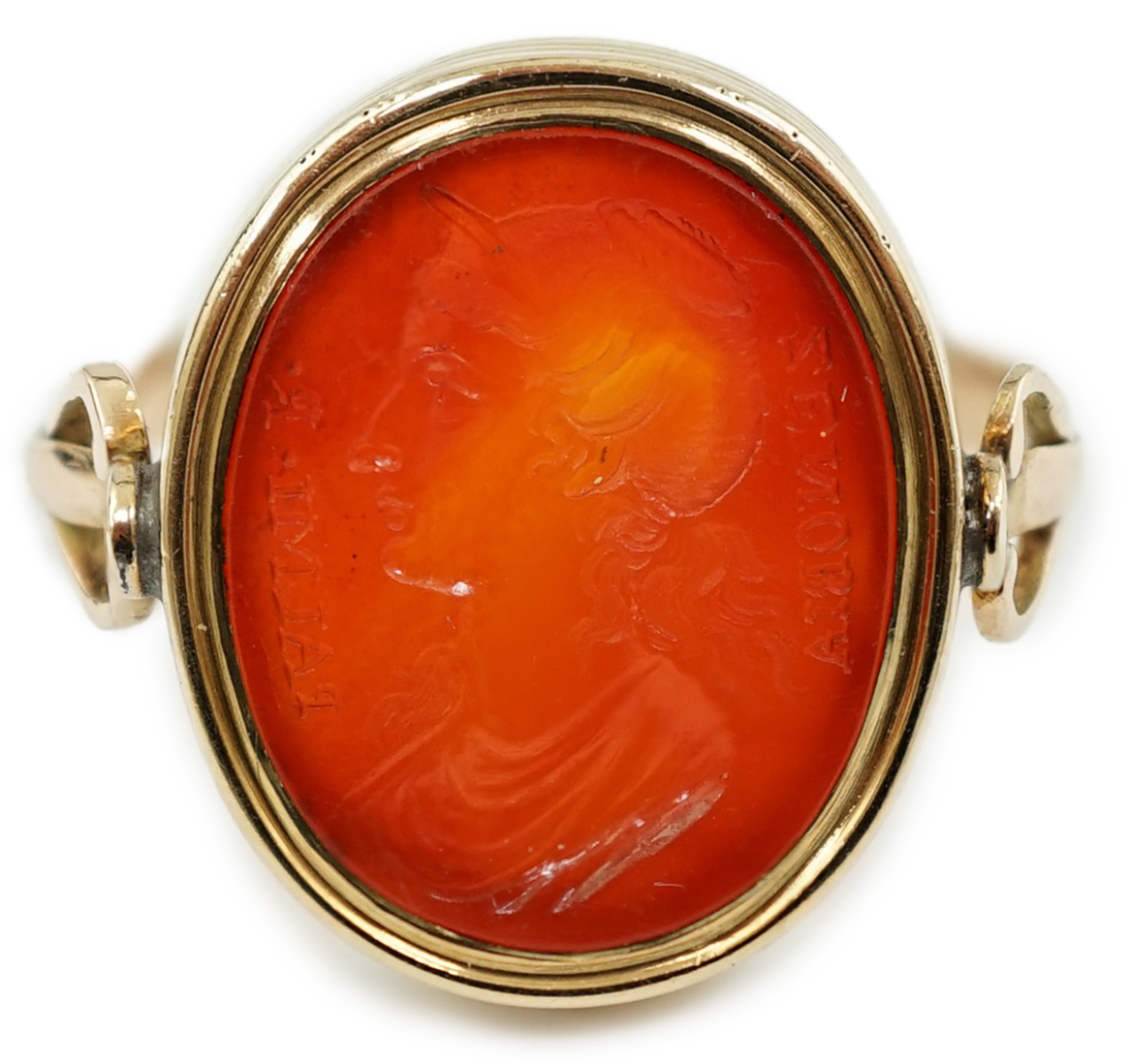 A 19th century gold and intaglio carnelian set oval signet ring